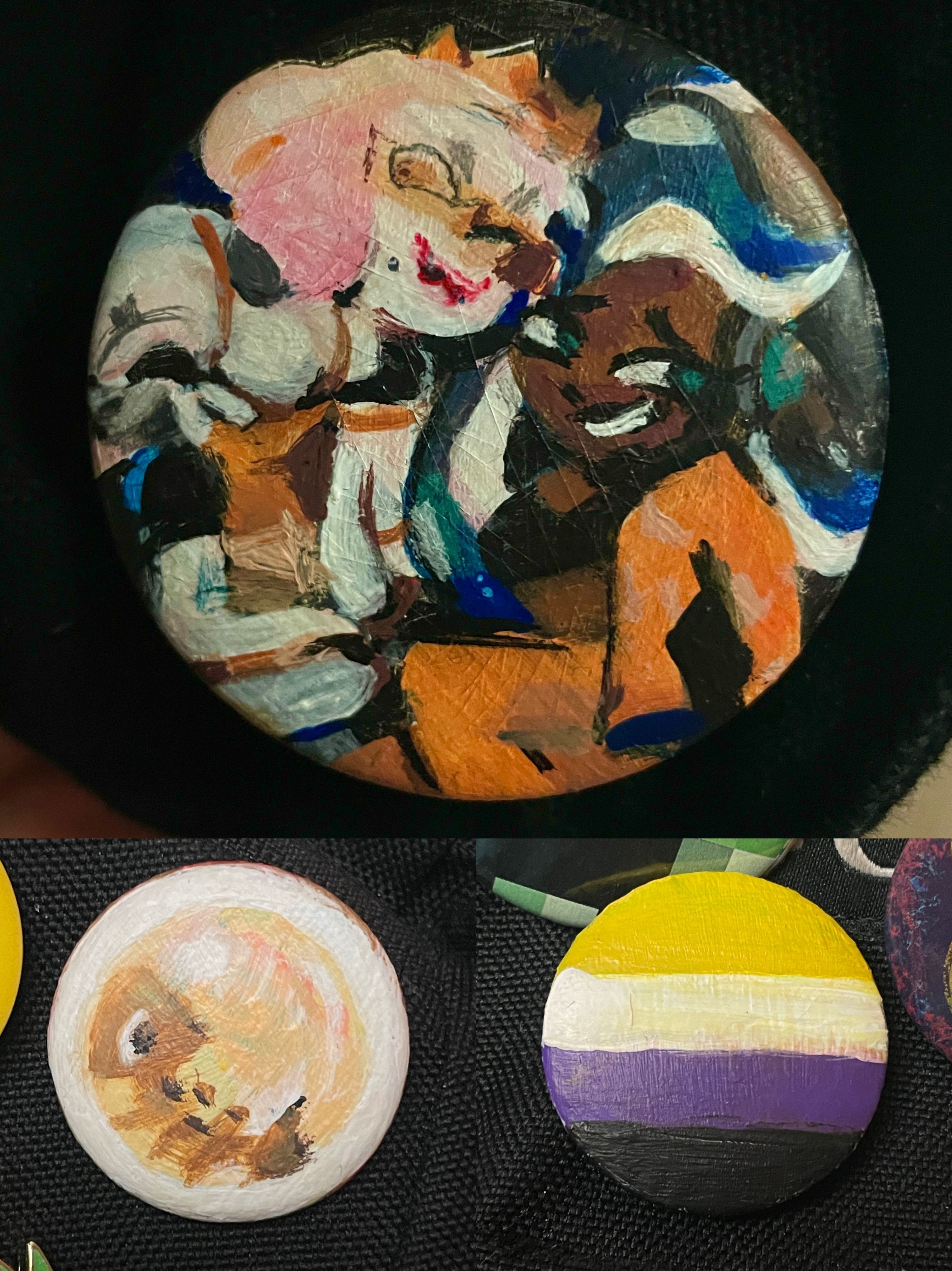 3 handpainted pins, one of pearl and marina from splatoon 3, another of the nonbinary flag, and another of a golden egg from splatoon.